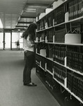 Female student in the Reference Section of Nyselius Library