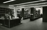 Olga Lichacz at the reference desk, Nyselius Library