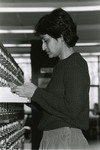 Female patron at the card catalog