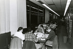Students at study tables in the reference section of Nyselius Library