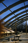 View of sky and arches of Alumni Hall construction looking due south