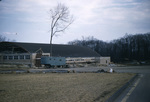 Alumni Hall construction with trailer looking southwest