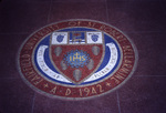 Mosaic of the official seal of Fairfield University in the foyer of Alumni Hall