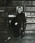 Rev. Joseph D. Fitzgerald, S.J., President of Fairfield University (1951-1958) with books