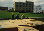 Fairfield University students constructing Cardboard City on campus