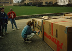 Student spray-painting at Cardboard City 1990