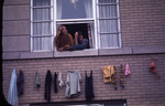 Two female students at a dorm window