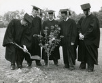 Graduates of the Class of 1958 plant the class tree