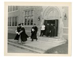 Graduates exiting Xavier Hall